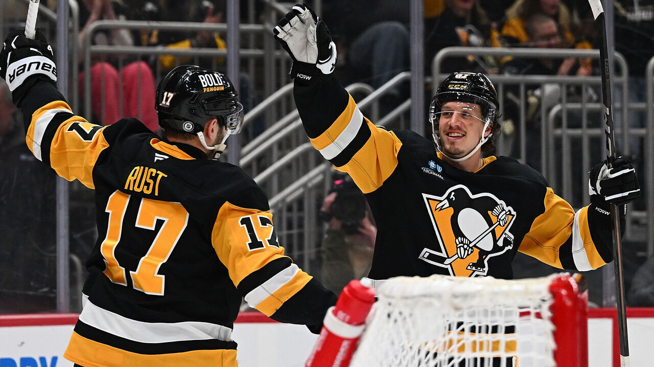 PITTSBURGH, PENNSYLVANIA - MARCH 13: Bryan Rust #17 of the Pittsburgh Penguins celebrates with Rickard Rakell #67 after scoring a goal in the third period during the game against the St. Louis Blues at PPG PAINTS Arena on March 13, 2025 in Pittsburgh, Pennsylvania.