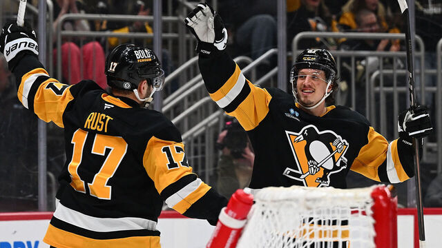 PITTSBURGH, PENNSYLVANIA - MARCH 13: Bryan Rust #17 of the Pittsburgh Penguins celebrates with Rickard Rakell #67 after scoring a goal in the third period during the game against the St. Louis Blues at PPG PAINTS Arena on March 13, 2025 in Pittsburgh, Pennsylvania.