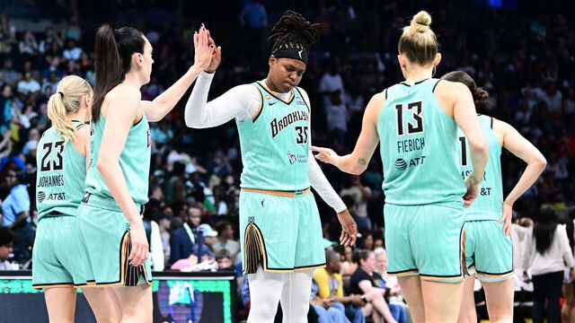 BROOKLYN, NY - JUNE 14: Jonquel Jones #35, Breanna Stewart #30, and Leonie Fiebich #13 of the New York Liberty high five during the game against the Washington Mystics during the WNBA Commissioner's Cup on June 14, 2026 at Barclays Center Arena in Brooklyn, New York. Mandatory Copyright Notice: Copyright 2026 NBAE