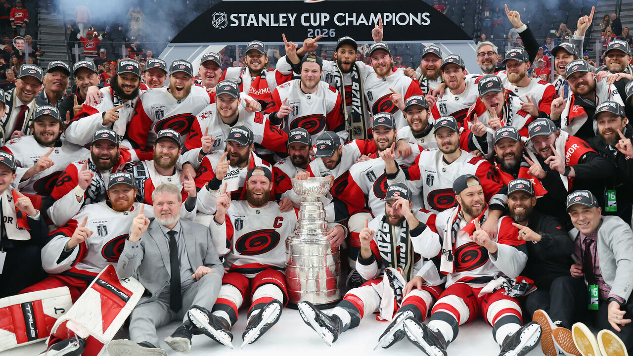 LAS VEGAS, NEVADA - JUNE 14: The Carolina Hurricanes pose for a picture after winning in Game Six of the 2026 Stanley Cup Final against the Vegas Golden Knights 3-0 at T-Mobile Arena on June 14, 2026 in Las Vegas, Nevada.