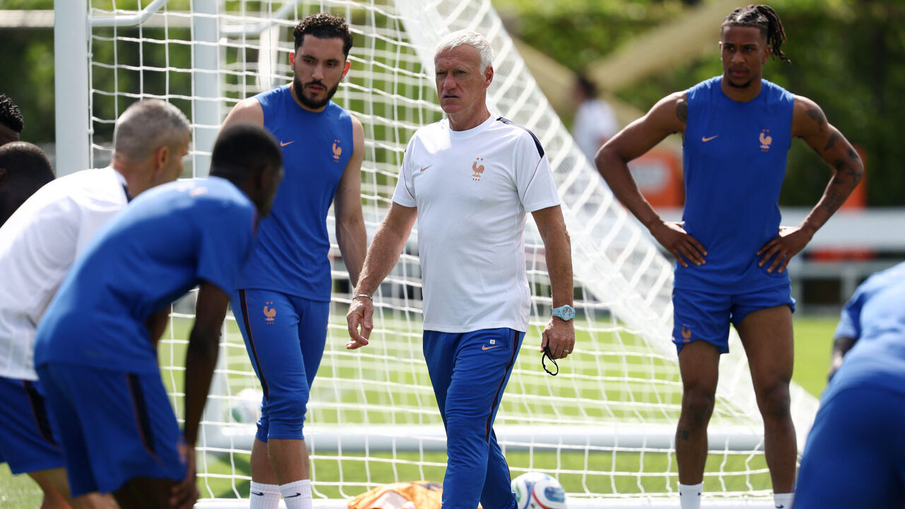 France's head coach Didier Deschamps, forward #24 Rayan Cherki and forward #11 Michael Olise take part in a training session at Melanie Lane Training Grounds in East Hannover, New Jersey on June 15, 2026, on the eve of the 2026 World Cup Group I football match between France and Senegal.