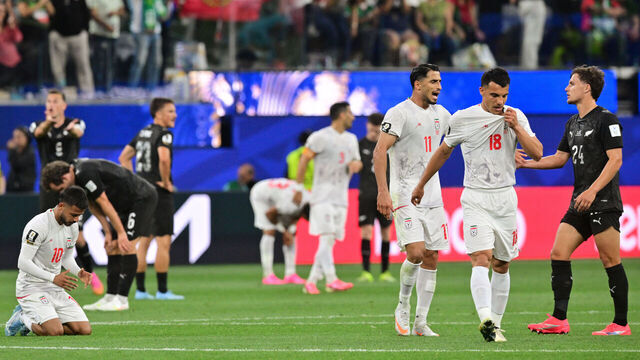 Iran's midfielder #10 Mehdi Ghayedi, forward #11 Ali Alipour, forward #18 Amirhossein Hosseinzadeh, and New Zealand's defender #24 Callan Elliot react after the 2026 World Cup Group G football match between Iran and New Zealand at Los Angeles Stadium in Inglewood on June 15, 2026.