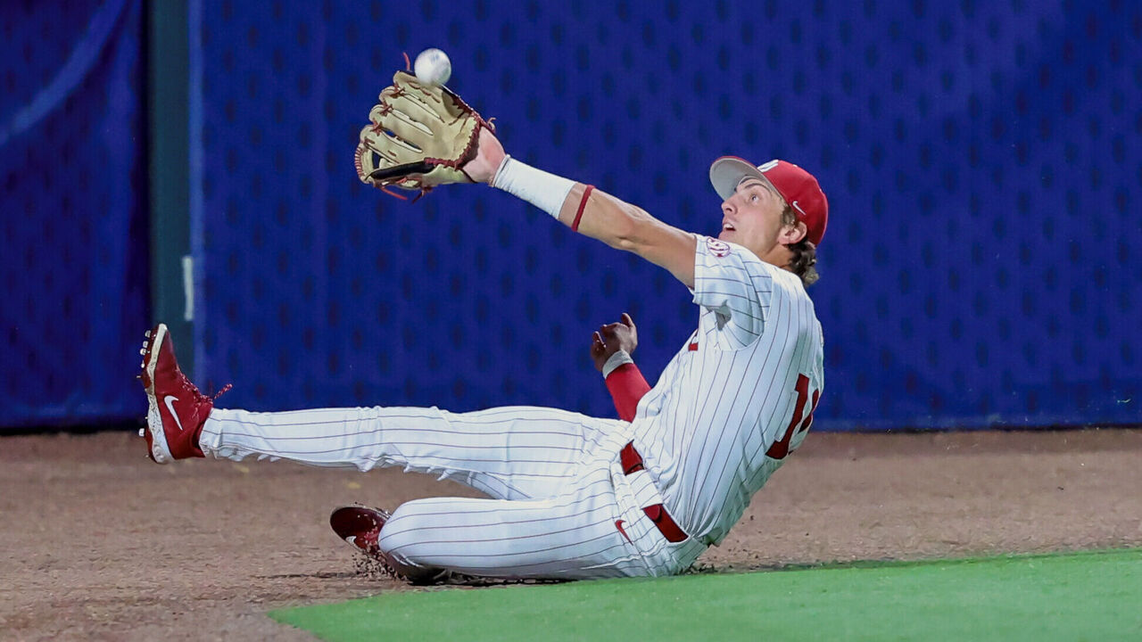 HOOVER, AL - MAY 19:Oklahoma catcher Brendan Brock (10) makes a sliding catch to end the inning during the SEC Baseball Tournament game between the Oklahoma Sooners and the LSU Tigers on May 19, 2026, at Hoover Metropolitan Stadium in Hoover, Alabama.