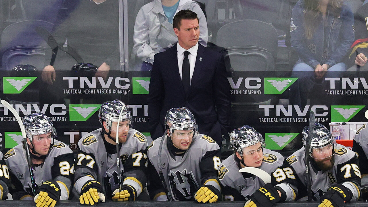 HENDERSON, NEVADA - FEBRUARY 20: Head coach Ryan Craig of the Henderson Silver Knights handles bench duties behind Trevor Connelly #24, Kai Uchacz #77, Mathieu Cataford #8, Sloan Stanick #92 and Mitch McLain #75 in the first period of their game against the Abbotsford Canucks at Lee's Family Forum on February 20, 2026 in Henderson, Nevada. The Silver Knights defeated the Canucks 6-3.