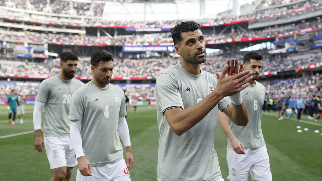 INGLEWOOD, CA - JUNE 15, 2026: Iran forward Mehdi Taremi (9) acknowledges the crowd with teammates, Iran forward Shahriyar Moghanlou (20), Iran defender Shojae Khalilzadeh (4) and Iran midfielder Saeid Ezatolahi (6) after the game at the World Cup group stage match between Iran and New Zealand at the SoFi Stadium on Monday, June 15, 2026 in Inglewood, CA. Iran and New Zealand tied 2-2. (Ronaldo Bolanos / Los Angeles Times via Getty Images)