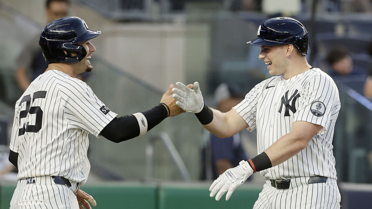 NEW YORK, NEW YORK - JUNE 16: Ben Rice #22 of the New York Yankees celebrates his two-run home run with teammate J.C. Escarra #25 in the fourth inning against the Chicago White Sox at Yankee Stadium on June 16, 2026 in New York City.