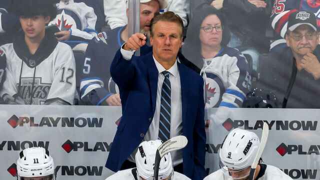 WINNIPEG, CANADA - OCTOBER 11: Head coach Jim Hiller of the Los Angeles Kings points out instructions from the bench during third period action against the Winnipeg Jets at Canada Life Centre on October 11, 2025 in Winnipeg, Manitoba, Canada.
