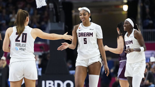 TORONTO, CANADA - JUNE 14: Angel Reese #5 and Isobel Borlase #20 of the Atlanta Dream high five during the game attends the game between the during the WNBA Commissioner's Cup on June 14, 2026 at Coca-Cola Coliseum in Toronto, Canada. Mandatory Copyright Notice: Copyright 2026 NBAE