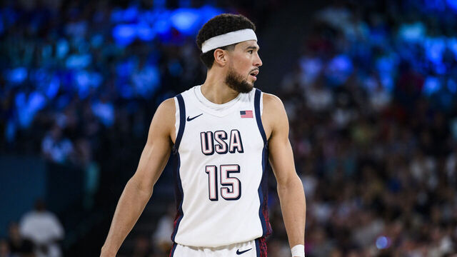 PARIS, FRANCE - AUGUST 8: Devin Booker of Team United States looks on during a Men's basketball semifinals match between Team United States and Team Serbia on day thirteen of the Olympic Games Paris 2024 at the Bercy Arena on August 8, 2024 in Paris, France.