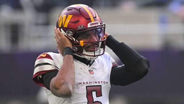 MINNEAPOLIS, MN - DECEMBER 07: Washington Commanders quarterback Jayden Daniels (5) listens to a play call during a NFL game between the Minnesota Vikings and Washington Commanders on December 7, 2025, at U.S. Bank Stadium in Minneapolis, MN.