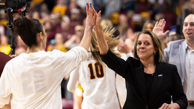 MINNEAPOLIS, MINNESOTA - MARCH 22: Dawn Plitzuweit head coach of the Minnesota Golden Gophers greets Kennedy Klick #22 before a second round game of the 2026 NCAA Women's Basketball Tournament against the Ole Miss Rebels held at Williams Arena on March 22, 2026 in Minneapolis, Minnesota.