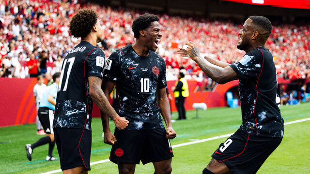 VANCOUVER, CANADA - JUNE 18: Jonathan David #10 of Canada celebrates with teammates after scoring his first goal during the first half of the FIFA World Cup 2026 Group B match against Qatar at BC Place Vancouver on June 18, 2026 in Vancouver, Canada.