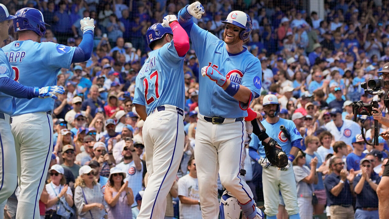 CHICAGO, IL - JUNE 19: Carson Kelly #15 of the Chicago Cubs celebrates with Seiya Suzuki #27 at home plate after hitting a grand slam home run in the first inning during the game between the Toronto Blue Jays and the Chicago Cubs at Wrigley Field on Friday, June 19, 2026 in Chicago, Illinois.