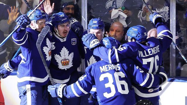 TORONTO, ON- JUNE 18 - Ryan Tverberg #77 of the Toronto Marlies is surrounded by teammates after scoring Toronto's third goal of the game in second period action as the Toronto Marlies play the Chicago Wolves in game four of the Calder Cup Final of the American Hockey League Championship at Coca-Cola Coliseum in Toronto. June 18, 2026. Steve Russell/Toronto Star (Steve Russell/Toronto Star via Getty Images)