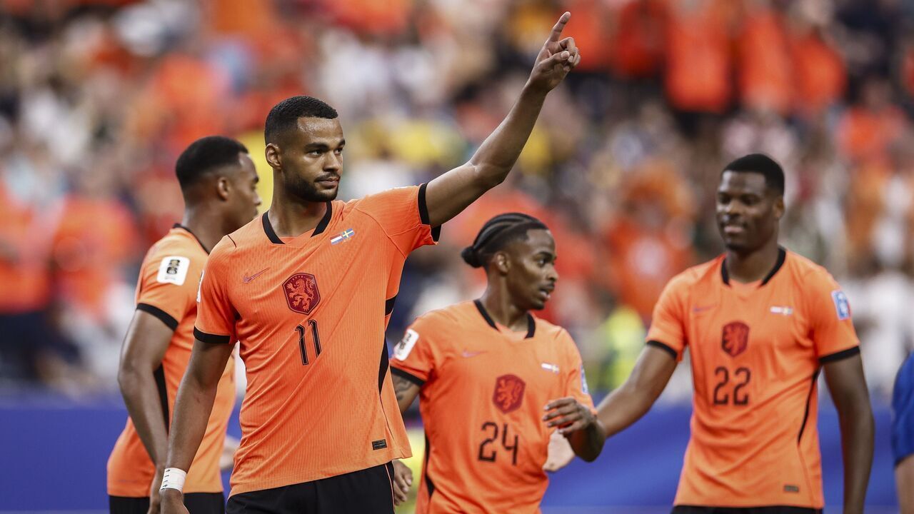 HOUSTON - Cody Gakpo of the Netherlands celebrates scoring the 4-0 with Crysencio Summerville of the Netherlands and Denzel Dumfries of the Netherlands during the 2026 FIFA World Cup Group F match between the Netherlands and Sweden at Houston Stadium on June 20, 2026, in Houston, United States. ROBIN VAN LONKHUIJSEN / ANP