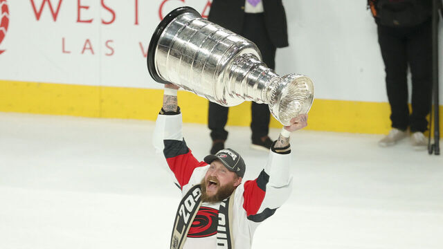 LAS VEGAS, NEVADA - JUNE 14: Nicolas Deslauriers #44 of the Carolina Hurricanes lifts the Stanley Cup after his team's 3-0 series clinching victory against the Vegas Golden Knights in Game Six of the 2026 Stanley Cup Final at T-Mobile Arena on June 14, 2026 in Las Vegas, Nevada.