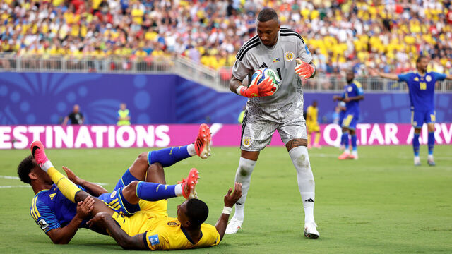 KANSAS CITY, MISSOURI - JUNE 20: Eloy Room #1 of Curacao makes a save as teammate Jurien Gaari #3 collides with Pervis Estupinan #7 of Ecuador during the FIFA World Cup 2026 Group E match between Ecuador and Curacao at Kansas City Stadium on June 20, 2026 in Kansas City, Missouri.