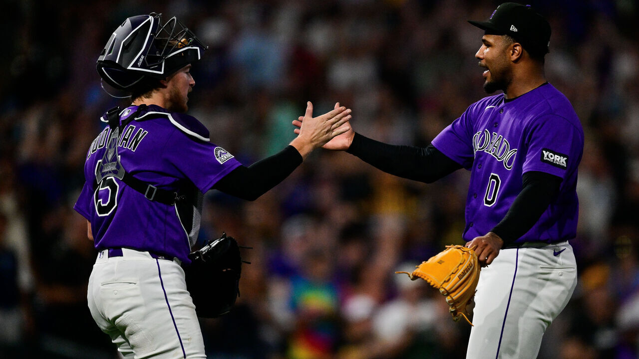 DENVER, COLORADO - JUNE 20: Jaden Hill #0 of the Colorado Rockies celebrates the win with Hunter Goodman #15 after a game against the Pittsburgh Pirates at Coors Field on June 20, 2026 in Denver, Colorado.
