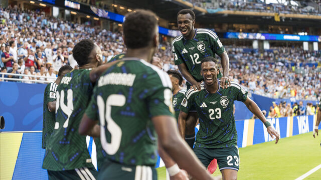 MIAMI GARDENS, FLORIDA - JUNE 15: Saudi Arabia players celebrate the goal of teammate Abdulelah Alamri (not pictured) during the FIFA World Cup 2026 Group H match between Saudi Arabia and Uruguay at Miami Stadium on June 15, 2026 in Miami Gardens, Florida.