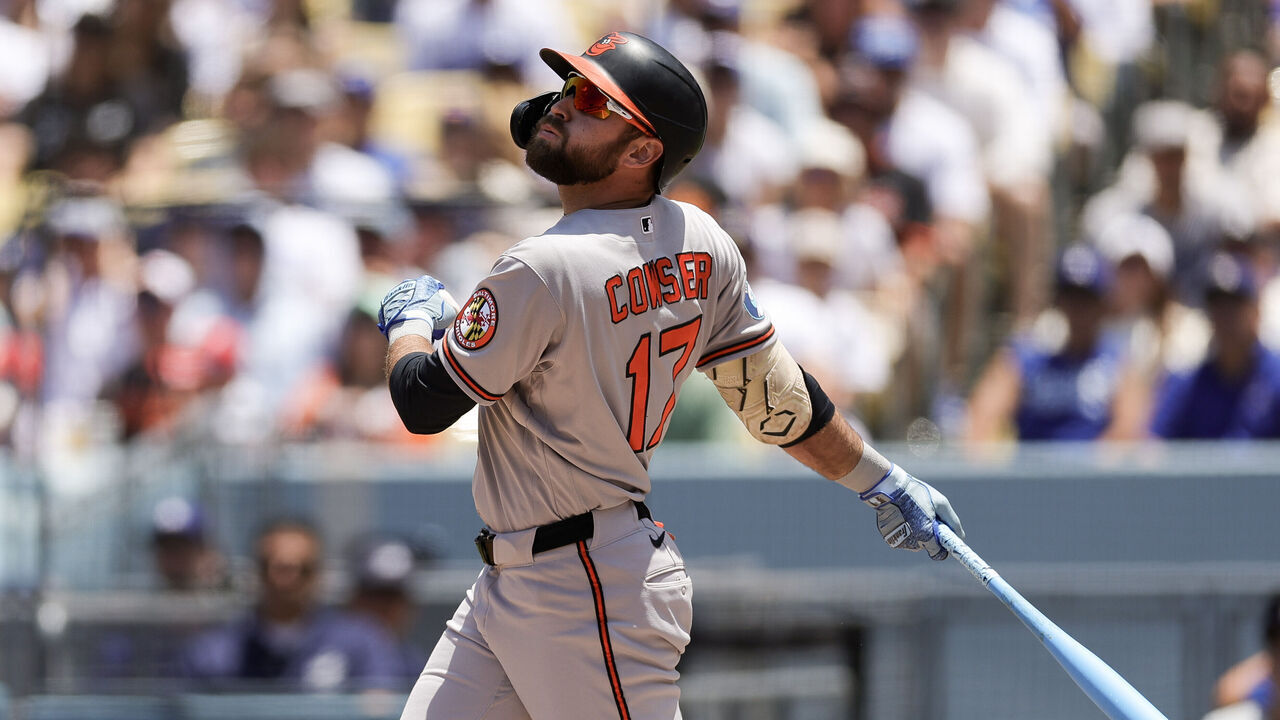 LOS ANGELES, CALIFORNIA - JUNE 21: Colton Cowser #17 of the Baltimore Orioles hits an RBI single during the first inning against the Los Angeles Dodgers at Dodger Stadium on June 21, 2026 in Los Angeles, California.