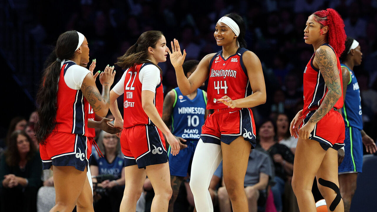 MINNEAPOLIS, MINNESOTA - JUNE 21: Kiki Iriafen #44 of the Washington Mystics celebrates against the Minnesota Lynx with teammates in the fourth quarter at Target Center on June 21, 2026 in Minneapolis, Minnesota. The Mystics defeated the Lynx 84-79.