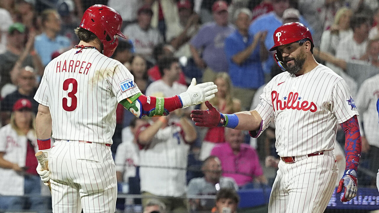 PHILADELPHIA, PENNSYLVANIA - JUNE 20: Kyle Schwarber #12 of the Philadelphia Phillies celebrates with Bryce Harper #3 after hitting a two run home run in the bottom of the seventh inning against the New York Mets at Citizens Bank Park on June 20, 2026 in Philadelphia, Pennsylvania. This was the third home run for Kyle Schwarber in the game. The Phillies defeated the Mets 15-3.