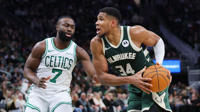 MILWAUKEE, WISCONSIN - NOVEMBER 10: Giannis Antetokounmpo #34 of the Milwaukee Bucks is defended by Jaylen Brown #7 of the Boston Celtics during a game at Fiserv Forum on November 10, 2024 in Milwaukee, Wisconsin.