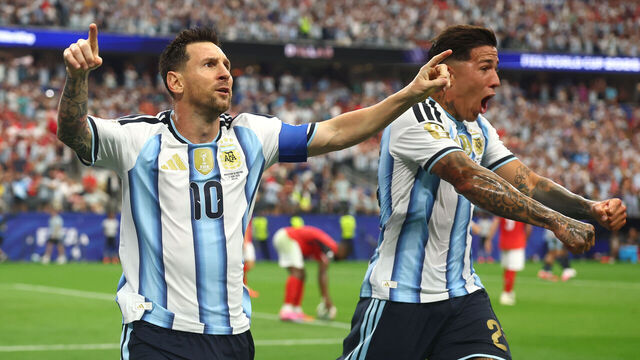 DALLAS, TEXAS - JUNE 22: Lionel Messi of Argentina celebrates scoring a goal to make the score 1-0 with Enzo Fernandez (R) during the FIFA World Cup 2026 Group J match between Argentina and Austria at Dallas Stadium on June 22, 2026 in Dallas, United States.