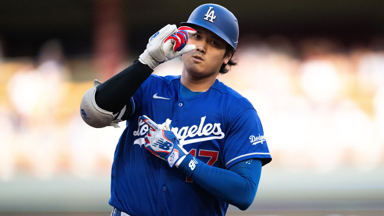 MINNEAPOLIS, MINNESOTA - JUNE 22: Shohei Ohtani #17 of the Los Angeles Dodgers hits a solo home run against the Minnesota Twins during the first inning of the game at Target Field on June 22, 2026 in Minneapolis, Minnesota.
