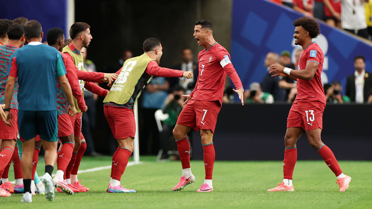HOUSTON, TEXAS - JUNE 23: Cristiano Ronaldo #7 of Portugal celebrates with teammates after scoring his team's first goal during the FIFA World Cup 2026 Group K match between Portugal and Uzbekistan at Houston Stadium on June 23, 2026 in Houston, Texas.