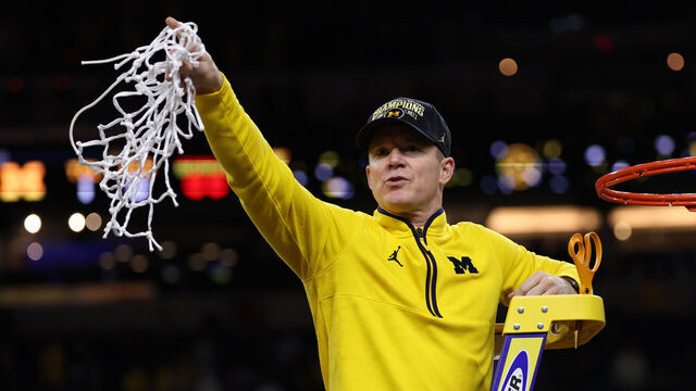 INDIANAPOLIS, INDIANA - APRIL 06: Head coach Dusty May of the Michigan Wolverines cuts down the net after defeating the UConn Huskies 69-63 in the National Championship of the 2026 NCAA Men's Basketball Tournament at Lucas Oil Stadium on April 06, 2026 in Indianapolis, Indiana.