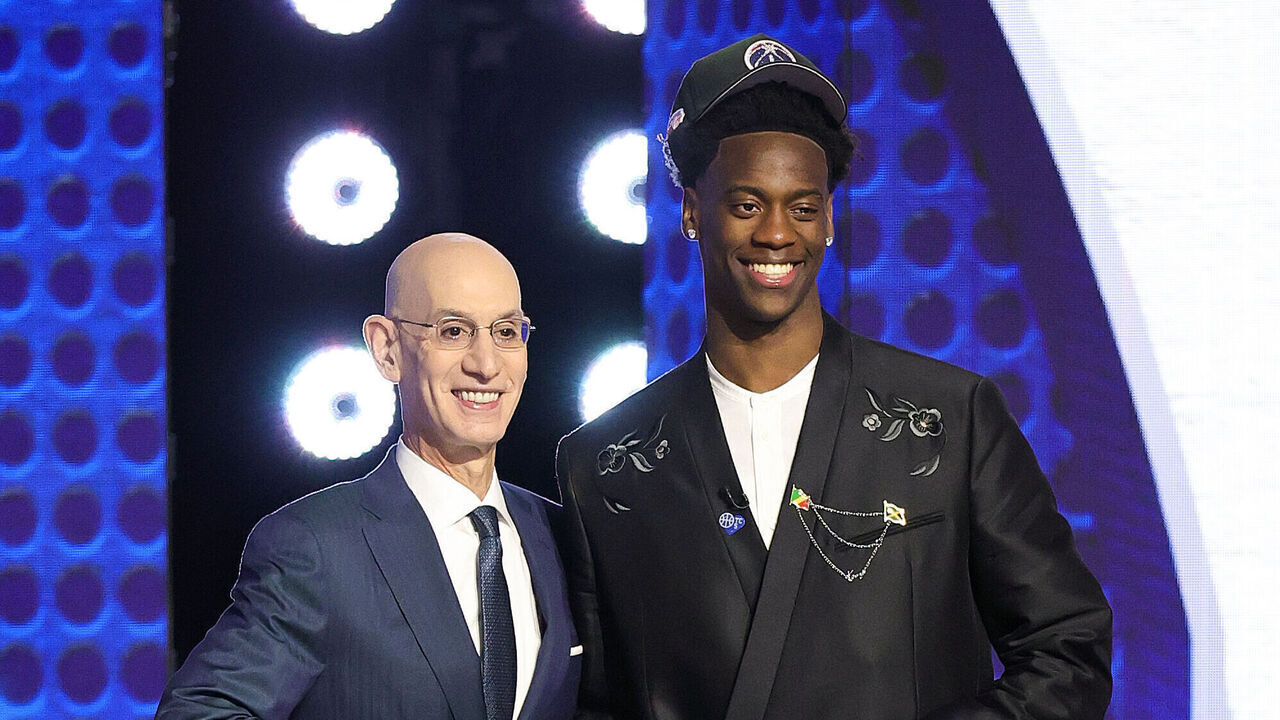 NEW YORK, NEW YORK - JUNE 23: NBA commissioner Adam Silver shakes hands with AJ Dybantsa after h is drafted first overall by the Washington Wizards during Round One of the 2026 NBA Draft at Barclays Center on June 23, 2026 in New York City.