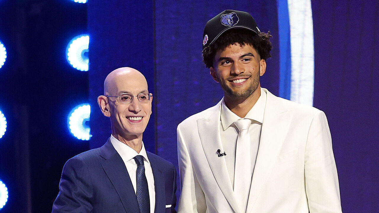 NEW YORK, NEW YORK - JUNE 23: NBA commissioner Adam Silver shakes hands with Cameron Boozer after he is drafted third overall by the Memphis Grizzlies during Round One of the 2026 NBA Draft at Barclays Center on June 23, 2026 in New York City.