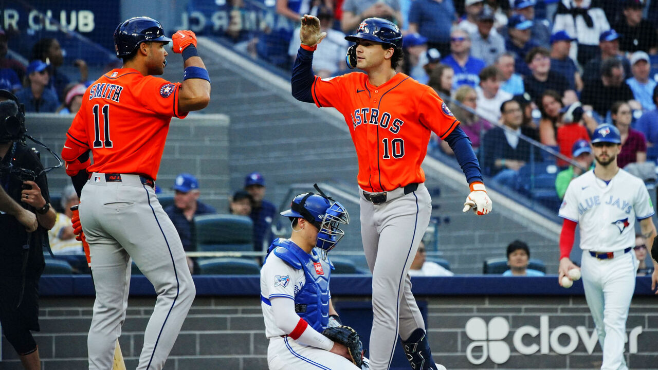 TORONTO, ON - JUNE 23: Joey Loperfido #10 of the Houston Astros celebrates with teammate Cam Smith #11 after hitting a home run in the 11th inning during the game between the Houston Astros and the Toronto Blue Jays at Rogers Centre on Tuesday, June 23, 2026 in Toronto, Ontario, Canada.