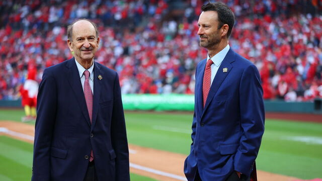 ST. LOUIS, MO - MARCH 27: St. Louis Cardinals Chairman & Chief Executive Officer Bill DeWitt Jr. talks with his son and Cardinals President William O. DeWitt III prior to the game between the Minnesota Twins and the St. Louis Cardinals at Busch Stadium on Thursday, March 27, 2025 in St. Louis, Missouri.
