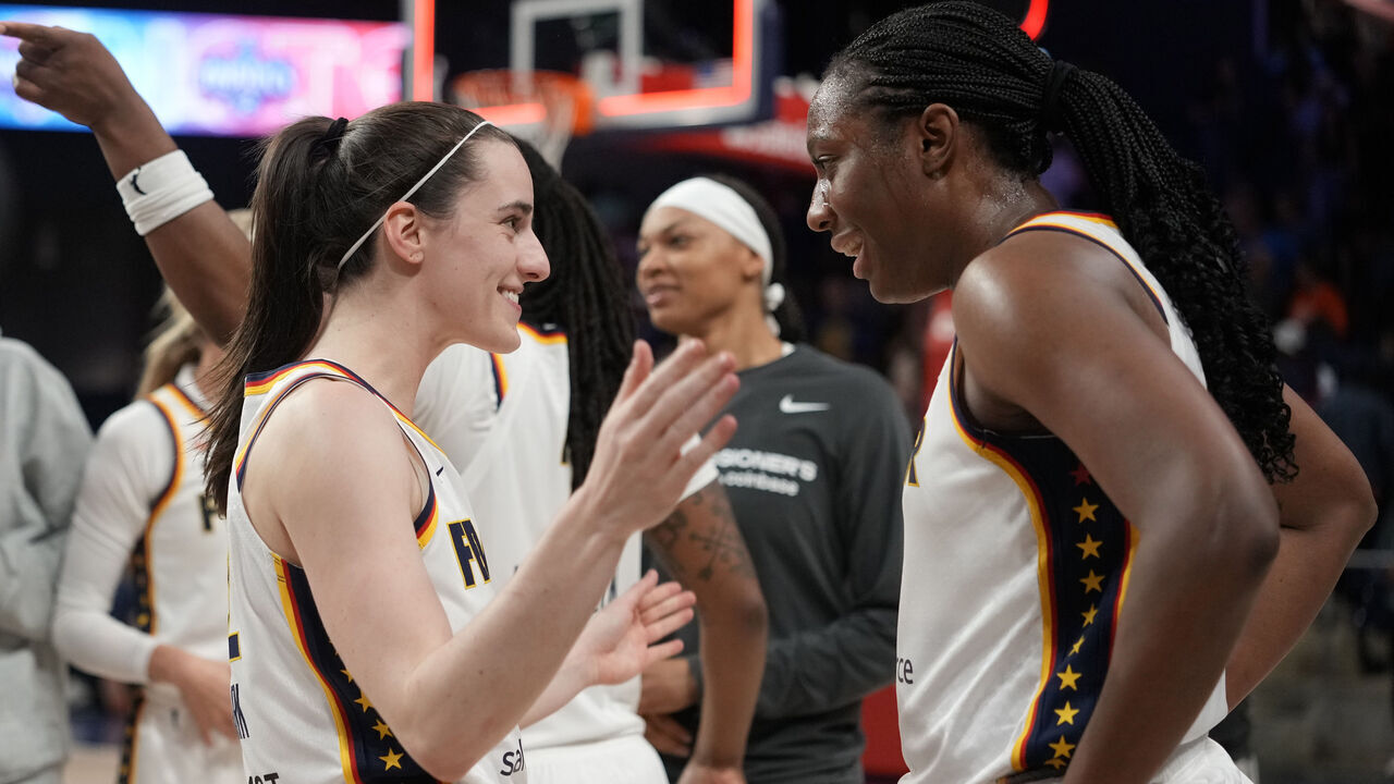 WASHINGTON, DC - JUNE 08: Caitlin Clark #22 of the Indiana Fever celebrates with Aliyah Boston #7 after scoring the game-winning three pointer during the second half against the Washington Mystics at CareFirst Arena on June 08, 2026 in Washington, DC.