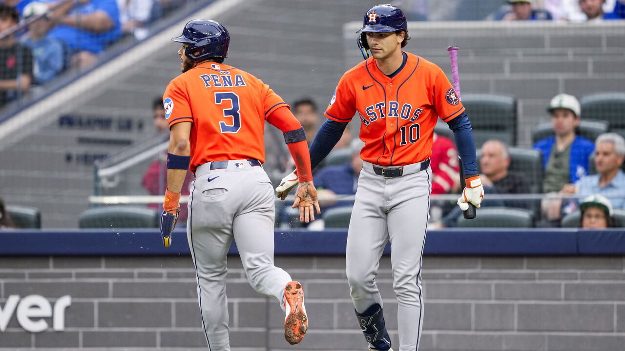 TORONTO, CANADA - JUNE 24: Jeremy Pena #3 of the Houston Astros celebrates scoring with Joey Loperfido against the Toronto Blue Jays during the first inning in their MLB game at the Rogers Centre on June 24, 2026 in Toronto, Ontario, Canada.