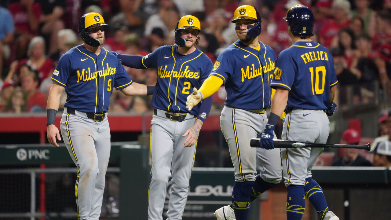 CINCINNATI, OHIO - JUNE 24: Jake Bauers #9, Brice Turang #2, William Contreras #24 and Sal Frelick #10 of the Milwaukee Brewers celebrate after Bauers, Turang, and Contreras scored runs in the seventh inning against the Cincinnati Reds at Great American Ball Park on June 24, 2026 in Cincinnati, Ohio.