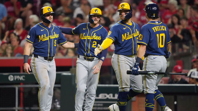 CINCINNATI, OHIO - JUNE 24: Jake Bauers #9, Brice Turang #2, William Contreras #24 and Sal Frelick #10 of the Milwaukee Brewers celebrate after Bauers, Turang, and Contreras scored runs in the seventh inning against the Cincinnati Reds at Great American Ball Park on June 24, 2026 in Cincinnati, Ohio.