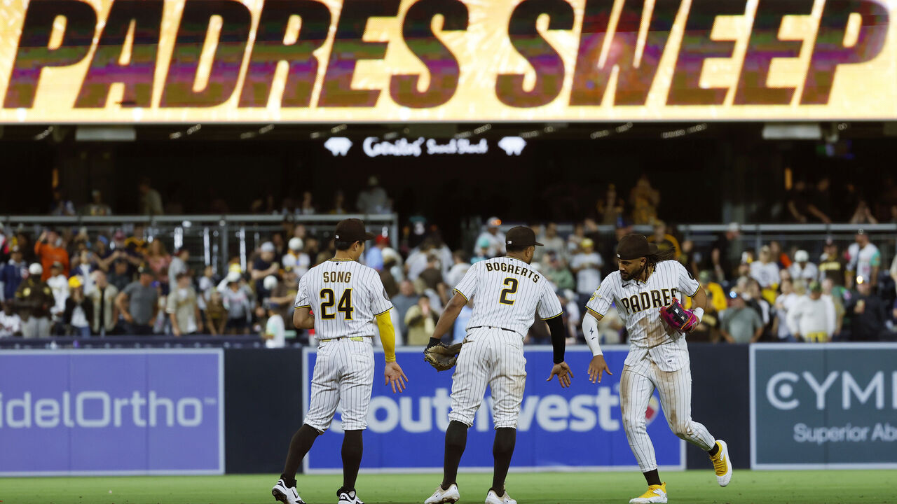 San Diego, CA - June 24: Sung-Mun Song #24 of the San Diego Padres celebrates with Xander Bogaerts #2 and Fernando Tatis Jr. #23 after a win against the Atlanta Braves at Petco Park on June 24, 2026 in San Diego, CA.