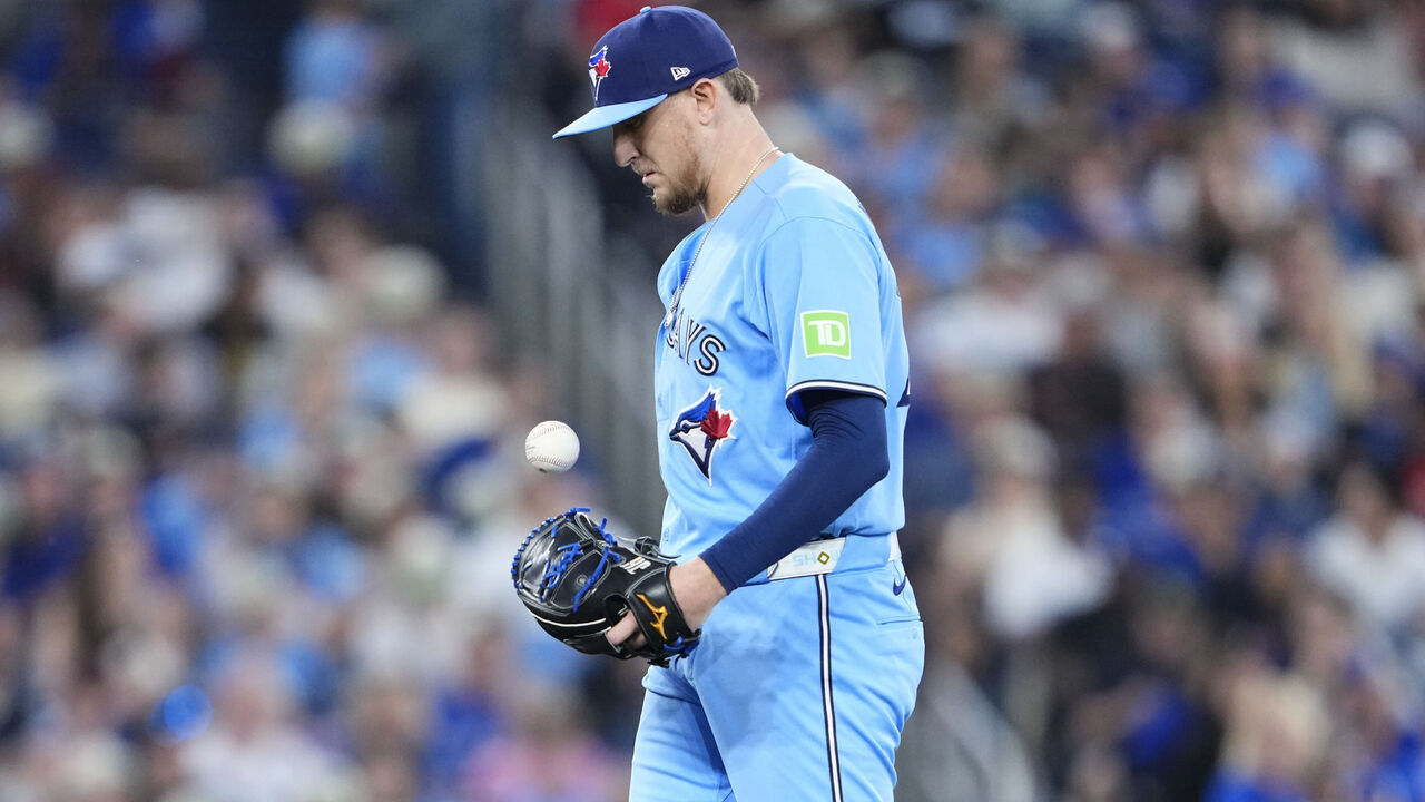 TORONTO, CANADA - JUNE 24: Jeff Hoffman #23 of the Toronto Blue Jays reacts after giving up a run on a throwing error from a pickoff attempt against the Toronto Blue Jays during the eighth inning after thin their MLB game at the Rogers Centre on June 24, 2026 in Toronto, Ontario, Canada.