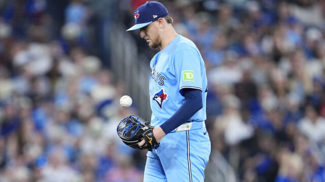 TORONTO, CANADA - JUNE 24: Jeff Hoffman #23 of the Toronto Blue Jays reacts after giving up a run on a throwing error from a pickoff attempt against the Toronto Blue Jays during the eighth inning after thin their MLB game at the Rogers Centre on June 24, 2026 in Toronto, Ontario, Canada.