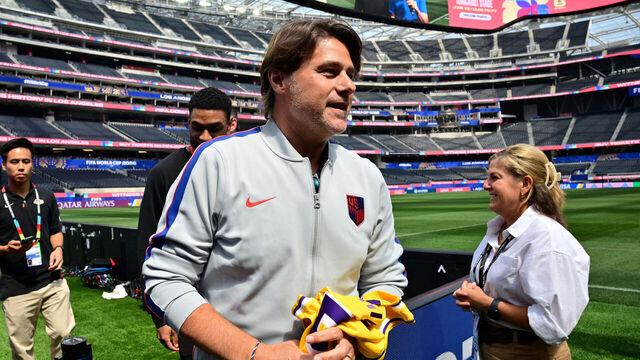 US Argentine head coach Mauricio Pochettino holds a Los Angeles Lakers jersey gifted by Los Angeles Lakers head coach JJ Redick (unseen) at Los Angeles Stadium on June 24, 2026, on the eve of the 2026 World Cup football tournament Group D football match between Turkey and USA.