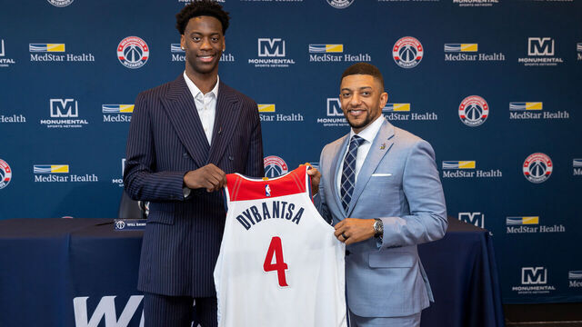 WASHINGTON, DC - JUNE 25: AJ Dybantsa #4 of the Washington Wizards and General Manager Will Dawkins pose for a photo during the Washington Wizards introductory press conference for AJ Dybantsa on June 25, 2026 at the Intercontinental Hotel in Washington,DC. Mandatory Copyright Notice: Copyright 2026 NBAE