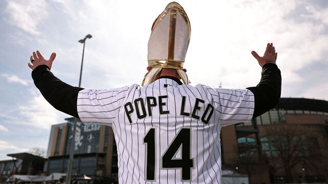 CHICAGO, IL - APRIL 03: A fan with a Pope Leo jersey poses for a photo outside Rate Field prior to the game between the Toronto Blue Jays and the Chicago White Sox on Friday, April 3, 2026 in Chicago, Illinois.