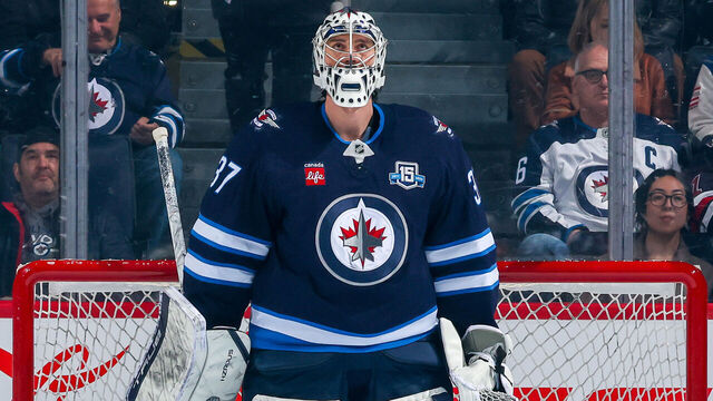 WINNIPEG, CANADA - APRIL 11: Goaltender Connor Hellebuyck #37 of the Winnipeg Jets looks on from his crease prior to NHL action against the Philadelphia Flyers at Canada Life Centre on April 11, 2026 in Winnipeg, Manitoba, Canada.