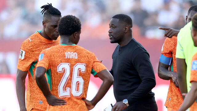 TORONTO, ONTARIO - JUNE 20: Emerse Fae, Head Coach of Cote d'Ivoire, speaks to players at the hydration break during the FIFA World Cup 2026 Group E match between Germany and Cote D'Ivoire at Toronto Stadium on June 20, 2026 in Toronto, Ontario.