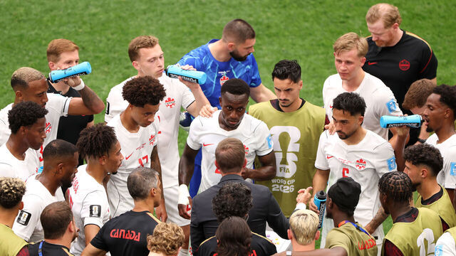 VANCOUVER, BRITISH COLUMBIA - JUNE 24: Jesse Marsch, Head Coach of Canada, speaks to players at the hydration break during the FIFA World Cup 2026 Group B match between Switzerland and Canada at BC Place Vancouver on June 24, 2026 in Vancouver, British Columbia.