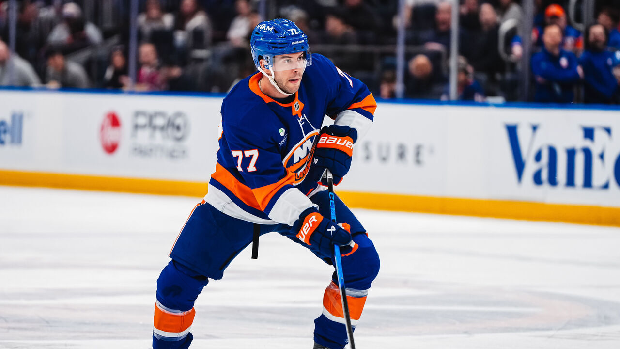 ELMONT, NEW YORK - APRIL 12: Tony DeAngelo #77 of the New York Islanders skates with the puck in the first period against the Montreal Canadiens at UBS Arena on April 12, 2026 in Elmont, New York.