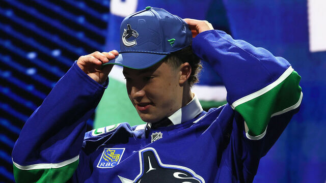 BUFFALO, NEW YORK - JUNE 26: NHL commissioner Gary Bettman looks on as Caleb Malhotra is drafted by the Vancouver Canucks with the third overall pick during day one of the 2026 NHL Draft on June 26, 2026 in Buffalo, New York.